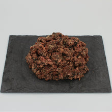 A patty of Beef Complete Mix all-natural raw dog food from Raw K9