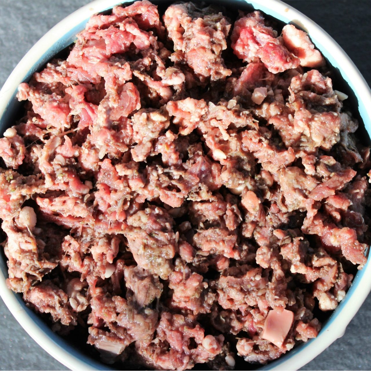 A bowl of Beef Complete Mix raw meat dog food from Raw K9